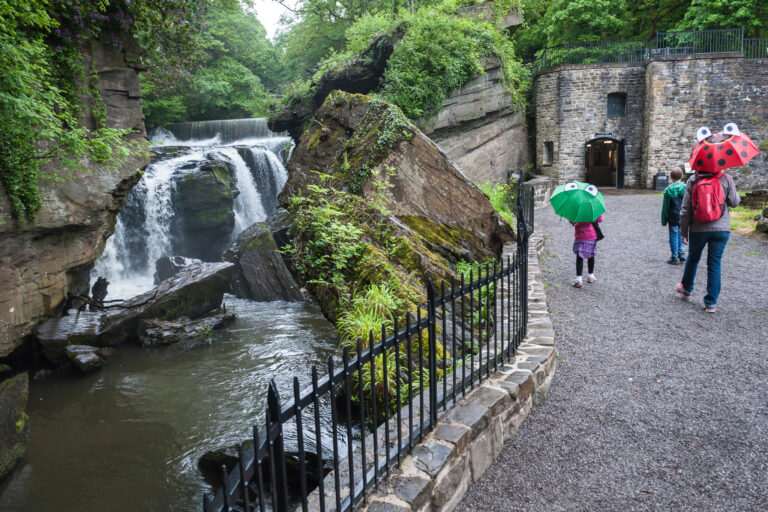 Aberdulais Visitors With Brollies 768x512